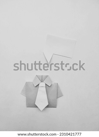 Origami shirt with tie and dialog cloud. Business concept