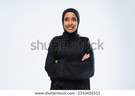Beautiful arab middle-eastern woman with traditional abaya dress in studio - Arabic muslim adult female portrait in Dubai, United Arab Emirates