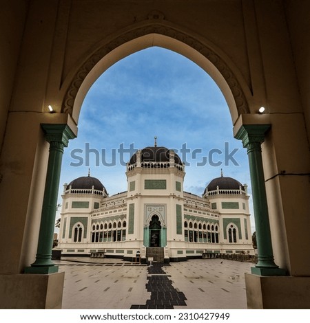 Masjid Raya Al-Mashun , The biggest mosque in Medan in a frame of the gate  Royalty-Free Stock Photo #2310427949