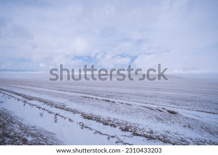 Snow covered the highway road in winter, Mongolia