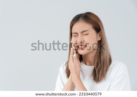 Asian woman feel toothache from gingivitis, female suffer tooth, decay problems, dental care. sensitive tooth, decay problem, bad breath, Gingival Recession, Oral Hygiene instruction, tooth extraction Royalty-Free Stock Photo #2310440579