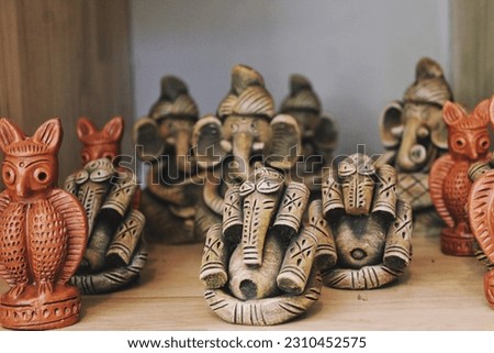 Handcrafted clay idols for home decor, colourful, idols dolls in marketplace