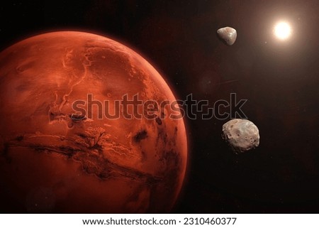 Planet Mars in the starry sky of solar system. Mars, Phobos and Deimos. Mars is a red planet of the solar system. High resolution image. Elements of this image furnished by NASA. Royalty-Free Stock Photo #2310460377