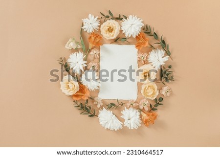 Floral wreath with textured cotton handmade paper on beige background. Aesthetic artistic wedding template. Holiday marketing concept.