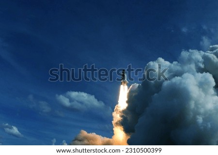 Rocket launch into space. Elements of this image furnishing NASA. High quality photo