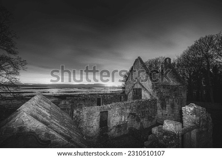 Ancient medieval stone ruins of historic 12th century church St. Bridget's at night along the seaside Fife Coastal Path in Dalgety Bay, Scotland, UK. Royalty-Free Stock Photo #2310510107