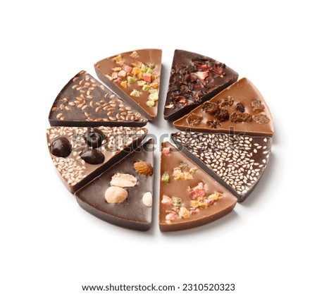 Chocolate pizza made of black and milk chocolate with candied fruits, nuts, raisins on a white background top view. Chocolate dessert in the form of pizza with different toppings.