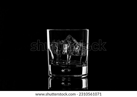 whiskey glass on black background 