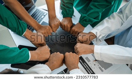 Stack of hands of International doctor team meeting hospital medical staff.