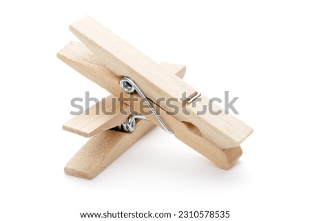 Wooden clothes pegs isolated on white background. Cutout. Clothespin.  Royalty-Free Stock Photo #2310578535