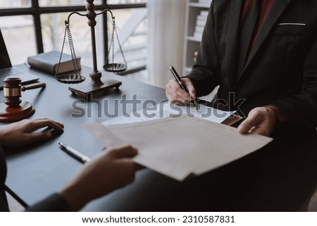 Lawyers or business consultants agree to accept forged documents and bribes in envelopes. in illegal business Corruption in the contracting business and bribed before signing the contract. Royalty-Free Stock Photo #2310587831