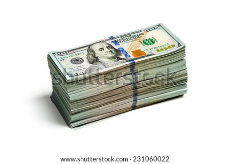 Creative business finance making money concept - large stack of new 100 US dollars 2013 edition banknote bills isolated on wooden background