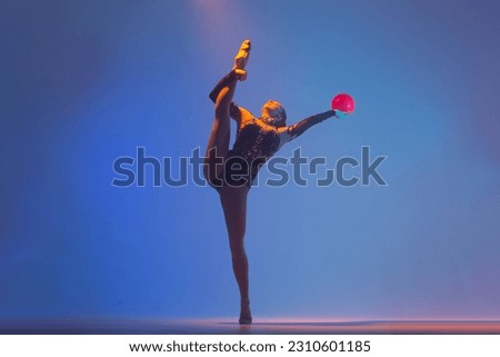 Rhythmic gymnastics. Rhythmic gymnast girl in action.