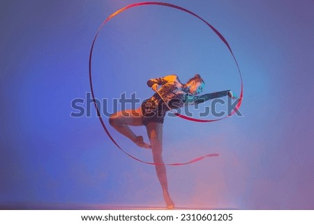Rhythmic gymnastics. Rhythmic gymnast girl in action.