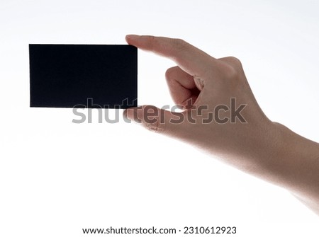 People hand holding a business card