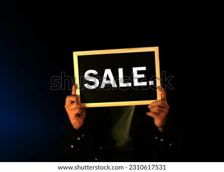 Signboard with text Sale for discounts on purchases.