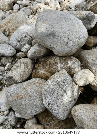 Pictures of rocks by the river. Beautiful as wallpaper, tiles, backgrounds and posters.