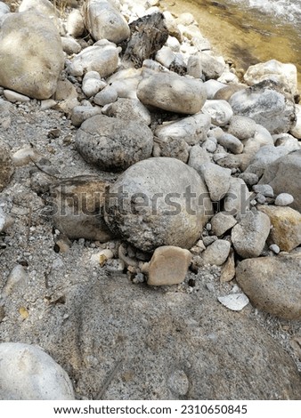 Pictures of rocks by the river. Beautiful as wallpaper, tiles, backgrounds and posters.