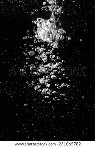 water splash on black background Royalty-Free Stock Photo #231065782