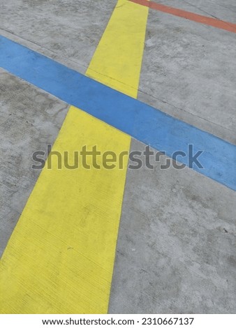 Yellow,blue and red line on the cement floor