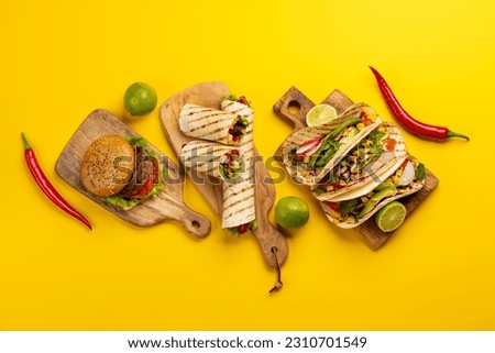 Mexican food featuring tacos, burritos, nachos, burgers and more. Flat lay