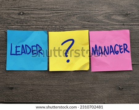 Leader or manager, text words typography written on paper, life and business motivational inspirational terms concept
