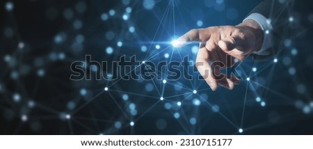 Close up of businessman hand pointing at creative glowing blurry plexus on dark background. Digital communication and network concept
