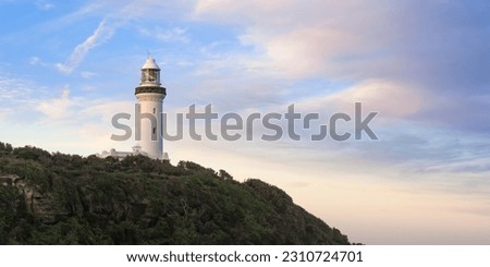 Lighthouse on a hill with a simple background, clouds. cover photo, banner photo