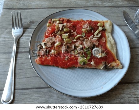 Pizza is a dish of Italian origin consisting of a usually round, flat base of leavened wheat-based dough topped with tomatoes, cheese, and often various other ingredients.