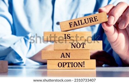 Close up on businessman holding a wooden block with a "Failure is not an option" message