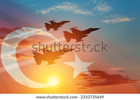 Aircraft silhouettes on background of sunset with a transparent Turkey flag. Turkish Air Force aerobatic demonstration. Air Force Day. Turkish Air Force Foundation Day. Royalty-Free Stock Photo #2310735649