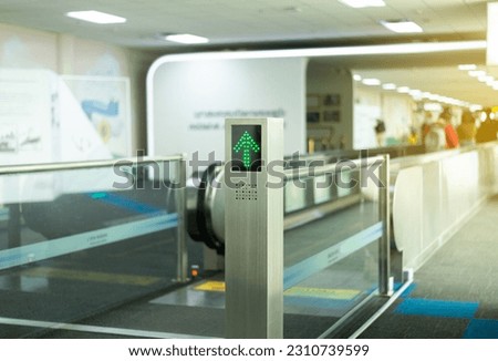 Signs entrance to escalator for passenger walking at international airport teminal