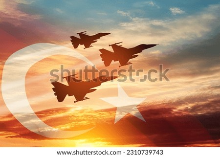 Aircraft silhouettes on background of sunset with a transparent Turkey flag. Turkish Air Force aerobatic demonstration. Air Force Day. Turkish Air Force Foundation Day. Royalty-Free Stock Photo #2310739743