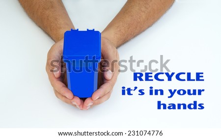 Male hands holding a blue garbage can, it's in your hands recycle