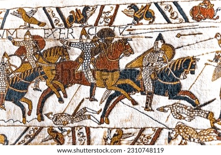 Bayeux tapestry, bayeux, normandy, france. created 11th century after battle of hastings 1066 ad showing norman conquest. cavalry battle and deaths Royalty-Free Stock Photo #2310748119