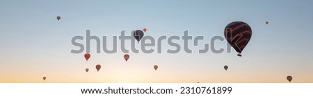 Hot air balloons. Banner photo of hot air balloons in Cappadocia. Travel to Turkey. Noise effect included.