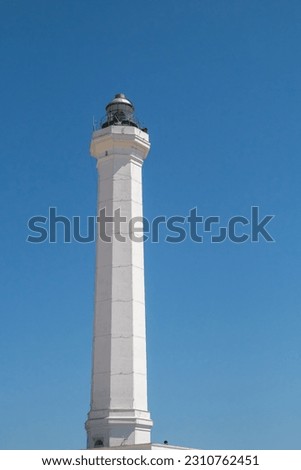 View of the lighthouse at the cape of Santa Maria di Leuca in Puglia, Italy. Details of the upper part on a clear summer day.