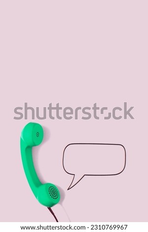 Green retro telephone on pink color background. Creative concept.
