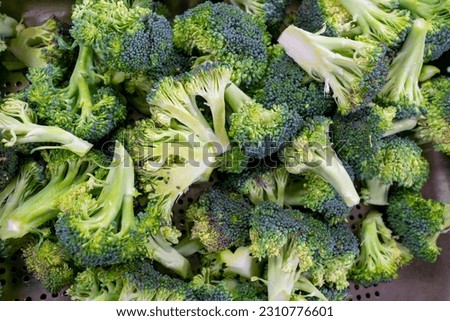 Close-up of broccoli florets ready for cooking Royalty-Free Stock Photo #2310776601