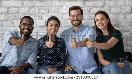 Diverse team of candidates successfully passed job interview, happy about hiring, showing thumb up like gesture. Applicants or customers satisfied with work condition, high quality service in company