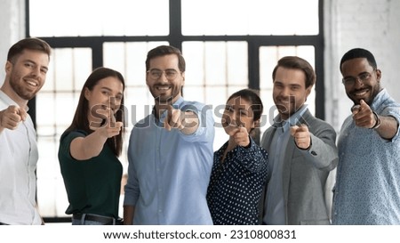 We need you. Happy confident professional group pointing finger at camera. Diverse millennial team of employees making choice, offering job, searching candidates for hiring. Head shot photo portrait
