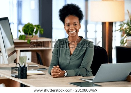 Portrait of happy black woman at desk with computer, smile and African entrepreneur with pride and tech. Confident businesswoman in office, small business startup and ceo at online management agency. Royalty-Free Stock Photo #2310803469