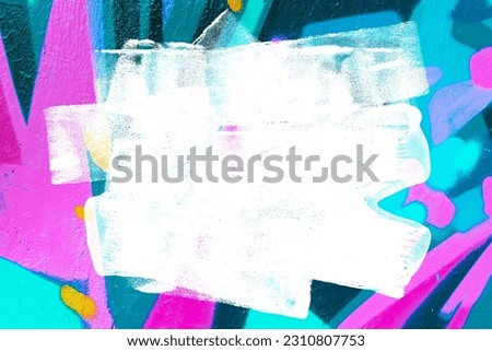 Closeup of colorful teal, pink, blue urban wall texture with white white paint stroke. Modern pattern for design. Creative urban city background. Grunge messy street style background with copy space Royalty-Free Stock Photo #2310807753