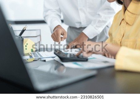 Salesmen are letting the male customers sign the sales contract, Asian women and couple are doing business in the office, Business concept and contract signing