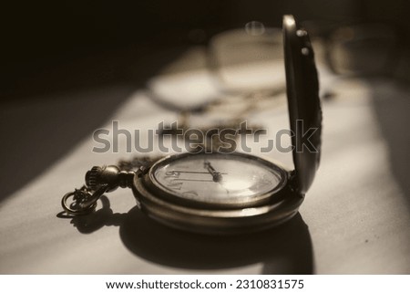 photo of vintage watch on white background with sun light