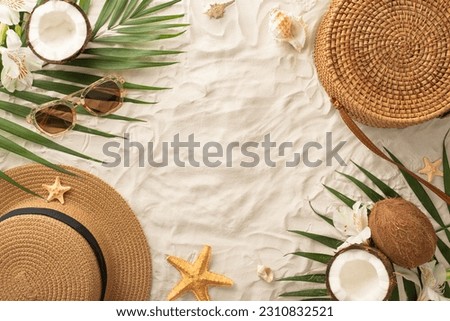 Get ready for ultimate summer getaway! Top view: sunglasses, sunhat, purse, seashell, starfish, palm leaves, alstroemeria and refreshing coconut on sandy beach backdrop with space for text or promo