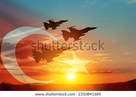 Aircraft silhouettes on background of sunset with a transparent Turkey flag. Turkish Air Force aerobatic demonstration. Air Force Day. Turkish Air Force Foundation Day. Royalty-Free Stock Photo #2310841689