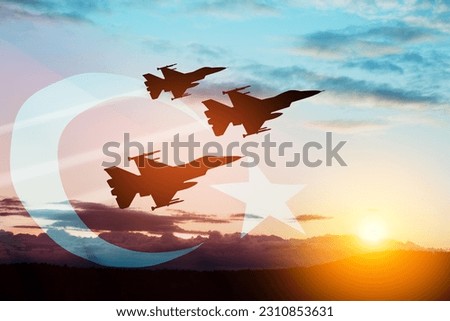 Aircraft silhouettes on background of sunset with a transparent Turkey flag. Turkish Air Force aerobatic demonstration. Air Force Day. Turkish Air Force Foundation Day. Royalty-Free Stock Photo #2310853631