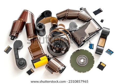 a collection of old photo films and memory card on white background