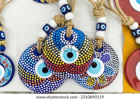 Bright colours of hand made symbolic  Evil eye lucky charms and amulets.